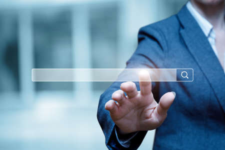 Business woman clicks on the search bar on the virtual screen.
