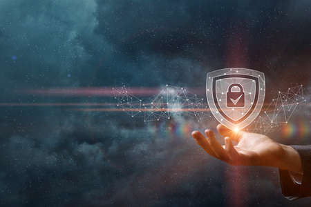 Network protection and security concept .Hand shows padlock shield.の写真素材