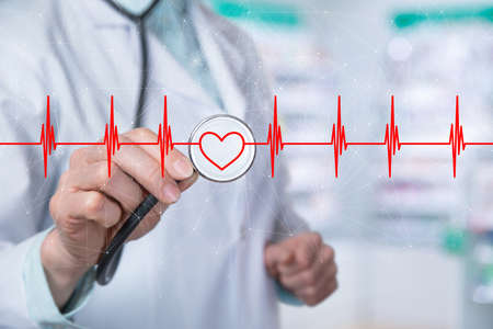 Heart disease diagnosis treatment concept. Doctor listens to heart icon on blurred background.