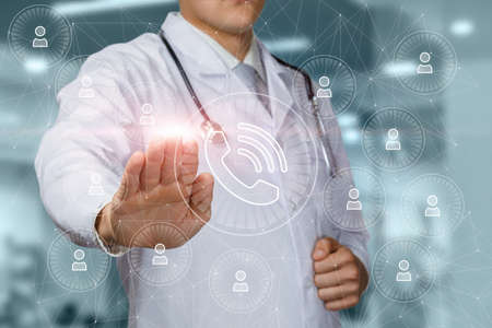 The doctor clicks on the call icon on the virtual screen.