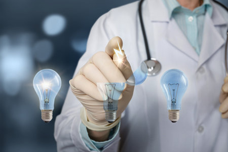 Laboratory engineer lays down alternative energy as idea on a blue background.の写真素材