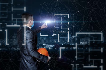 Civil engineer develop house plan on virtual screen against blurry city background.