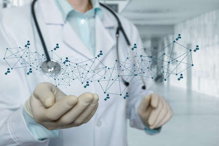 Doctor shows a medical network on a blurred background.の写真素材