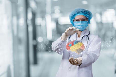 Doctor examines brain function on blurred background.