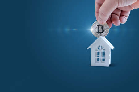 The concept of buying real estate for bitcoins.の写真素材