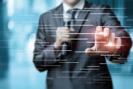 Business man makes a presentation with a microphone of a business project on a virtual computer screen.の写真素材