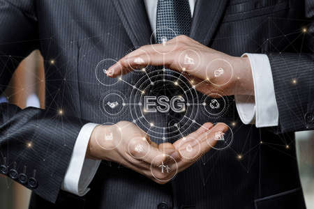 Business man defends with gesture environmental social governance business strategy.