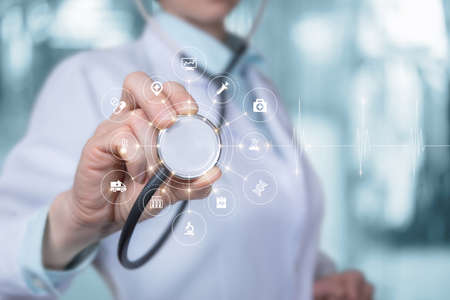 Health care and medical service delivery concept. Doctor Listens On Screen Medical Icons.の写真素材