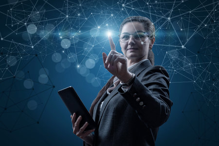 Business woman working online on a blue background.