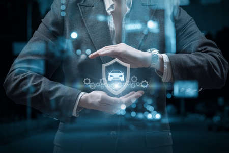 The concept of insurance and protection of vehicles on the roads.の写真素材