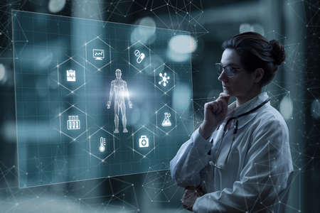 Doctor woman examines diagnose patient on virtual computer screen.の写真素材