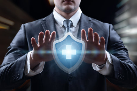 medical protection concept. A man in a suit shows a medical protection icon.の写真素材
