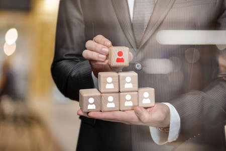 The concept of choosing a candidate in the hierarchy of workers.
