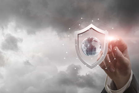 World security concept from war. Protective shield in front of the Globe from attack.の写真素材