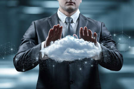 Cloud data protection concept. Businessman defend cloud.