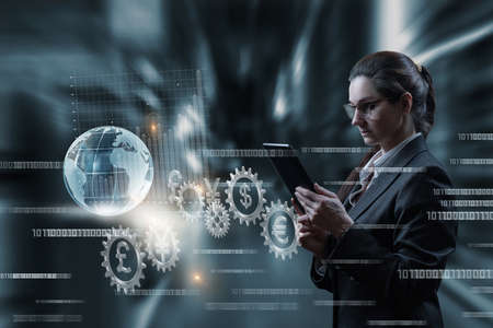 Business woman working on virtual computer screen with international trading system.の写真素材