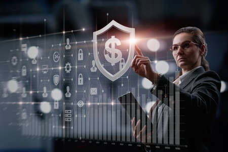 Businesswoman working with investments on virtual computer screen.の写真素材