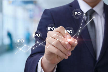 Businessman looking Initial Public Offering on a blurred background.の写真素材