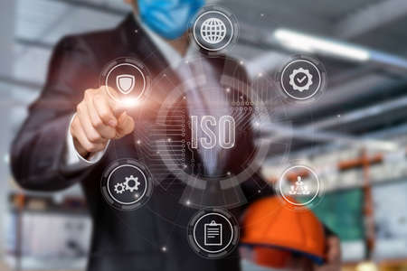 Civil engineer working with ISO in interface on a blurred background.の写真素材