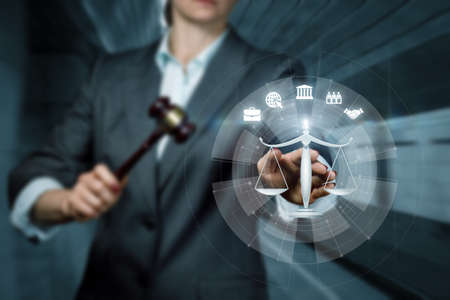 Lawier clicks on Scales of Justice on virtual computer screen.の写真素材