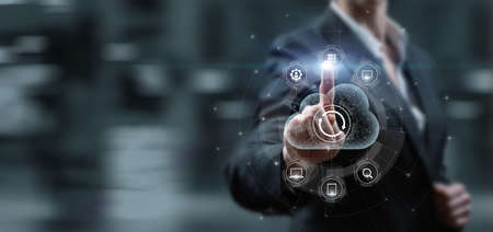 Woman clicks on virtual computer screen to data cloud for synchronization.