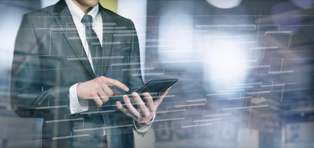 Businessman developing plan on virtual computer screen using tablet.の写真素材