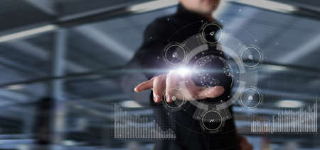 Manager working on virtual screen with global business management.の写真素材