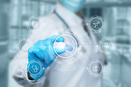 Doctor shows a pill to treat the disea on a virtual screen.