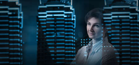 Business woman looks out the window and thinks about business.