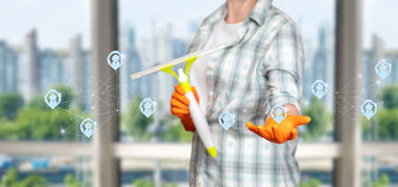 Cleaning lady shows cleaning locations on a virtual screen on the internet.