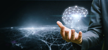 The hand shows a brain made of connections on a blurred background.の写真素材