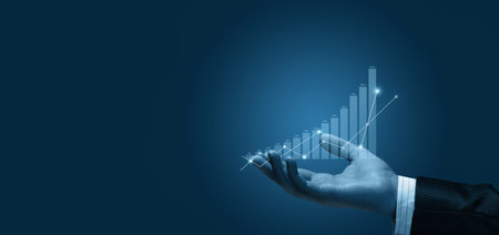Hand shows financial growth chart something on blue background.の写真素材