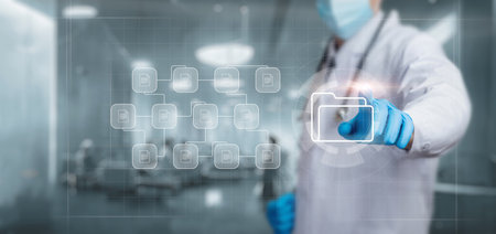 Doctor working with documents case histories on a virtual computer screen.の写真素材