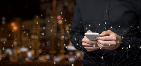 A businessman works in the foreign exchange market on the Internet on a blurred background.