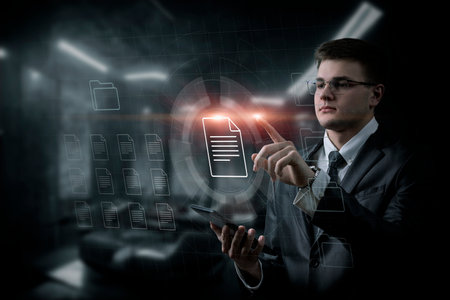 The manager works with file data interface on blurred background.の写真素材