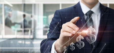 Businessman works with graph of financial growth and successful trading.の写真素材