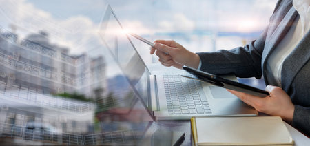 The concept of working in business and analytics with the help of modern technology.の写真素材