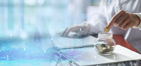 Doctor collects coins as savings during medical insurance.