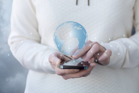 The concept of working in the global network using a mobile device.の写真素材