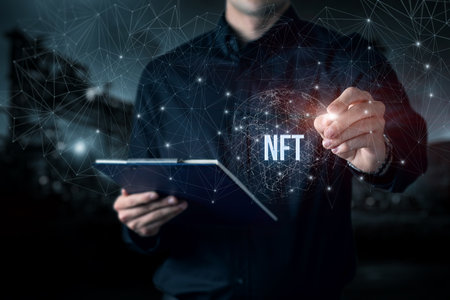 A businessman drawing a non-fungible token against a blurred background.の写真素材