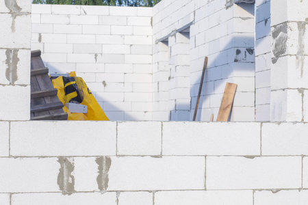 Wall with a gas block and an opening for a window.の写真素材