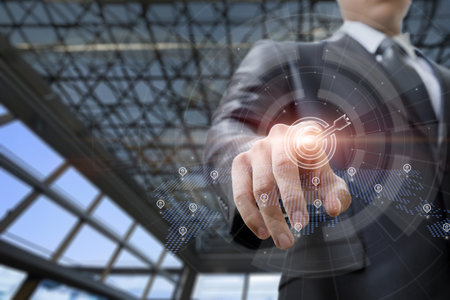 business goal concept. Businessman clicking target icon on blurred background.