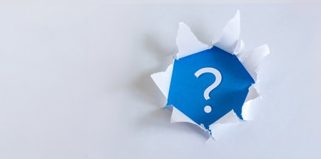 Question mark on a white sheet. The concept of a question posed.の写真素材
