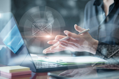 Concept of receiving emails and mail virtually on a computer or laptop.の写真素材