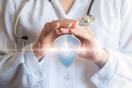 Concept of health protection and protection.The doctor protects a shield with a cross with a gesture.の写真素材