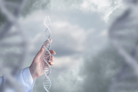 Close-up of doctor holding DNA molecule in front of cloudy sky.の写真素材