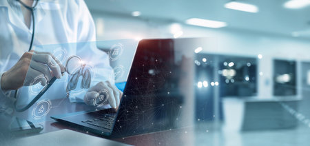 Doctor examines lungs at computer in modern office.