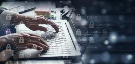 Businesswoman working at a computer on a secure Internet network.