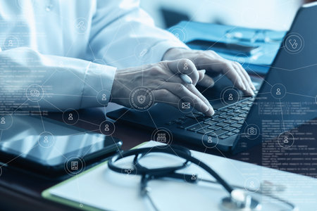 The doctor works with the help of modern technology and a computer in a medical service network.の写真素材