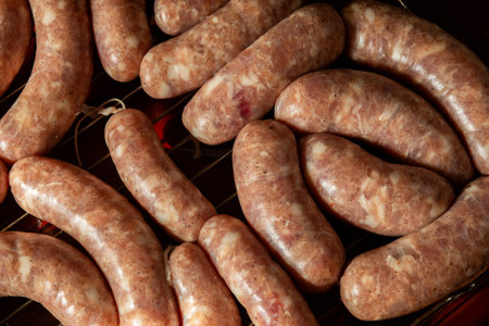 Homemade grilled sausages on dark background.の写真素材